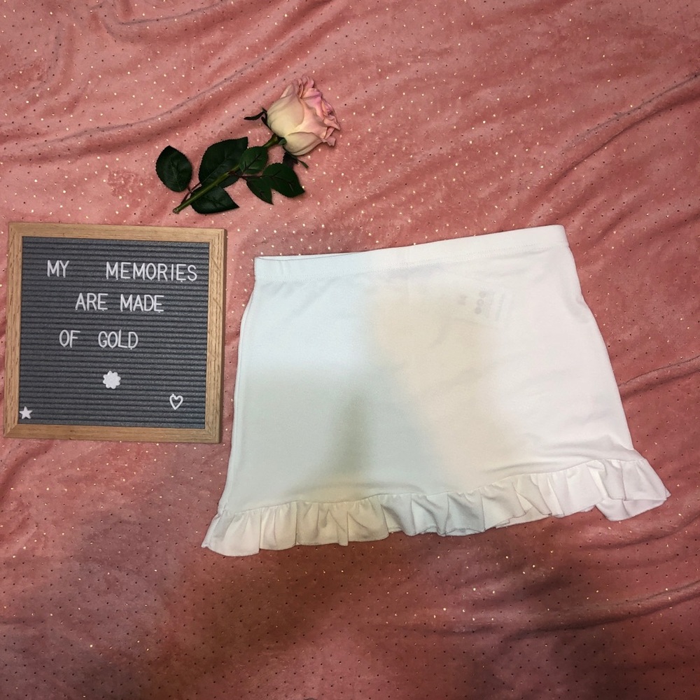 White mini skirt (slip needed)